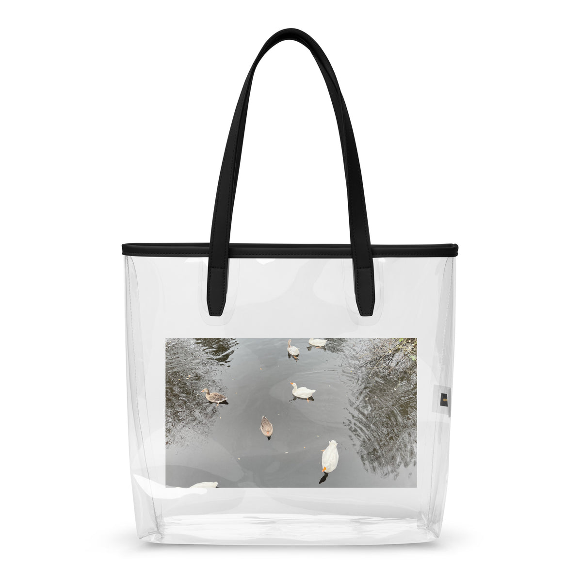 Doorzichtige draagtas Eindhoven | Clear stylish tote bag with scenic photo of ducks on water.