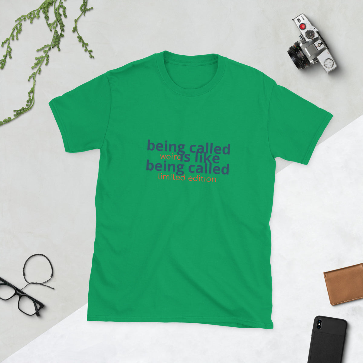 Black shirt displaying the quote 'being called weird is like being called limited edition weird quote shirt'.