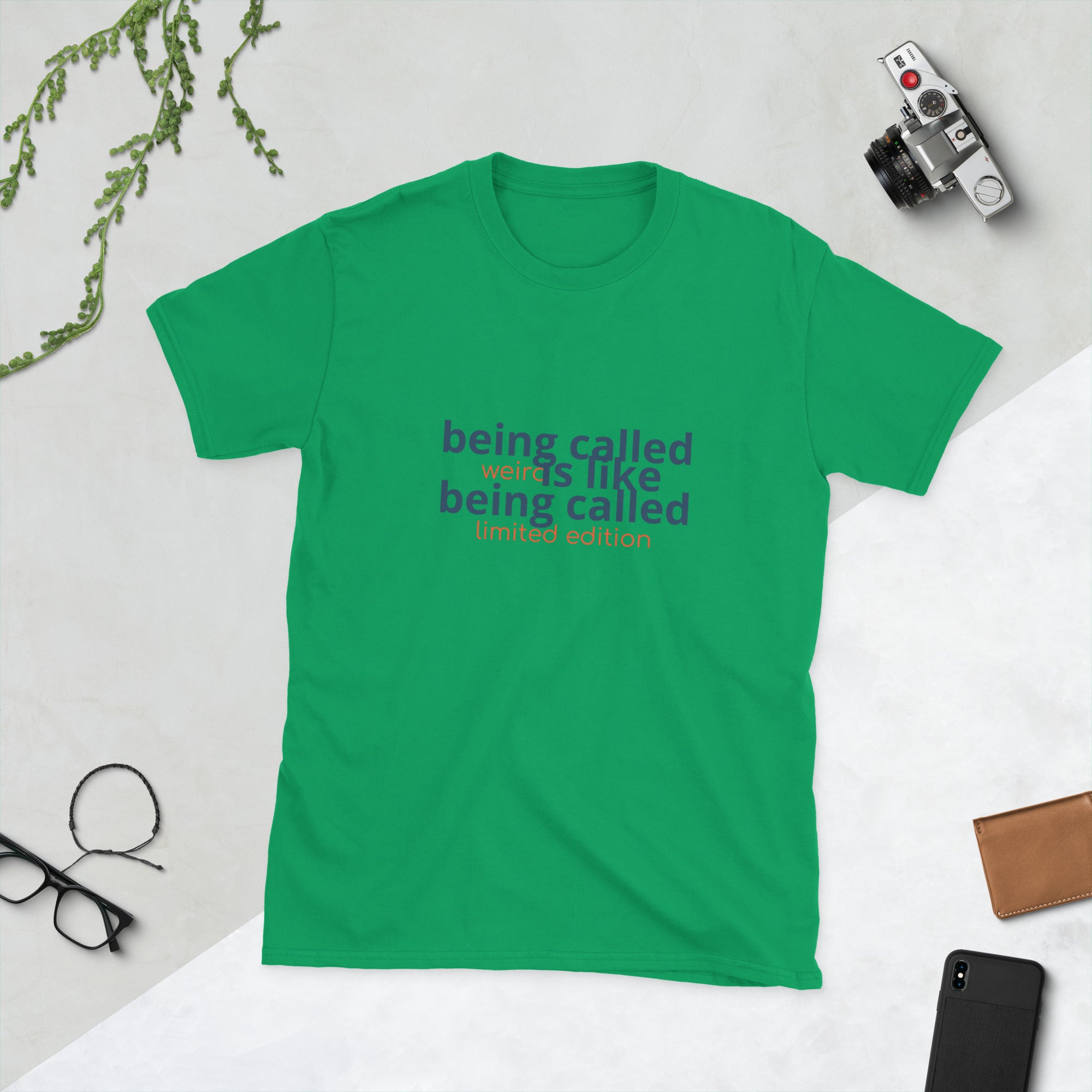 Black shirt displaying the quote 'being called weird is like being called limited edition weird quote shirt'.