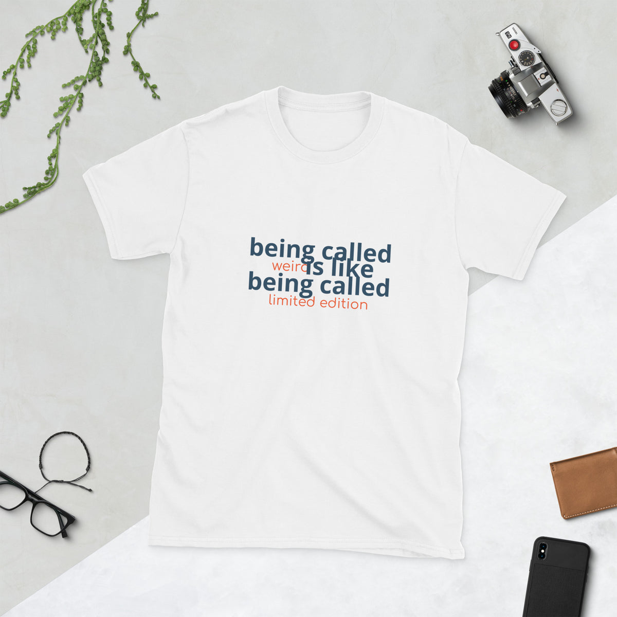 Black shirt displaying the quote 'being called weird is like being called limited edition weird quote shirt'.