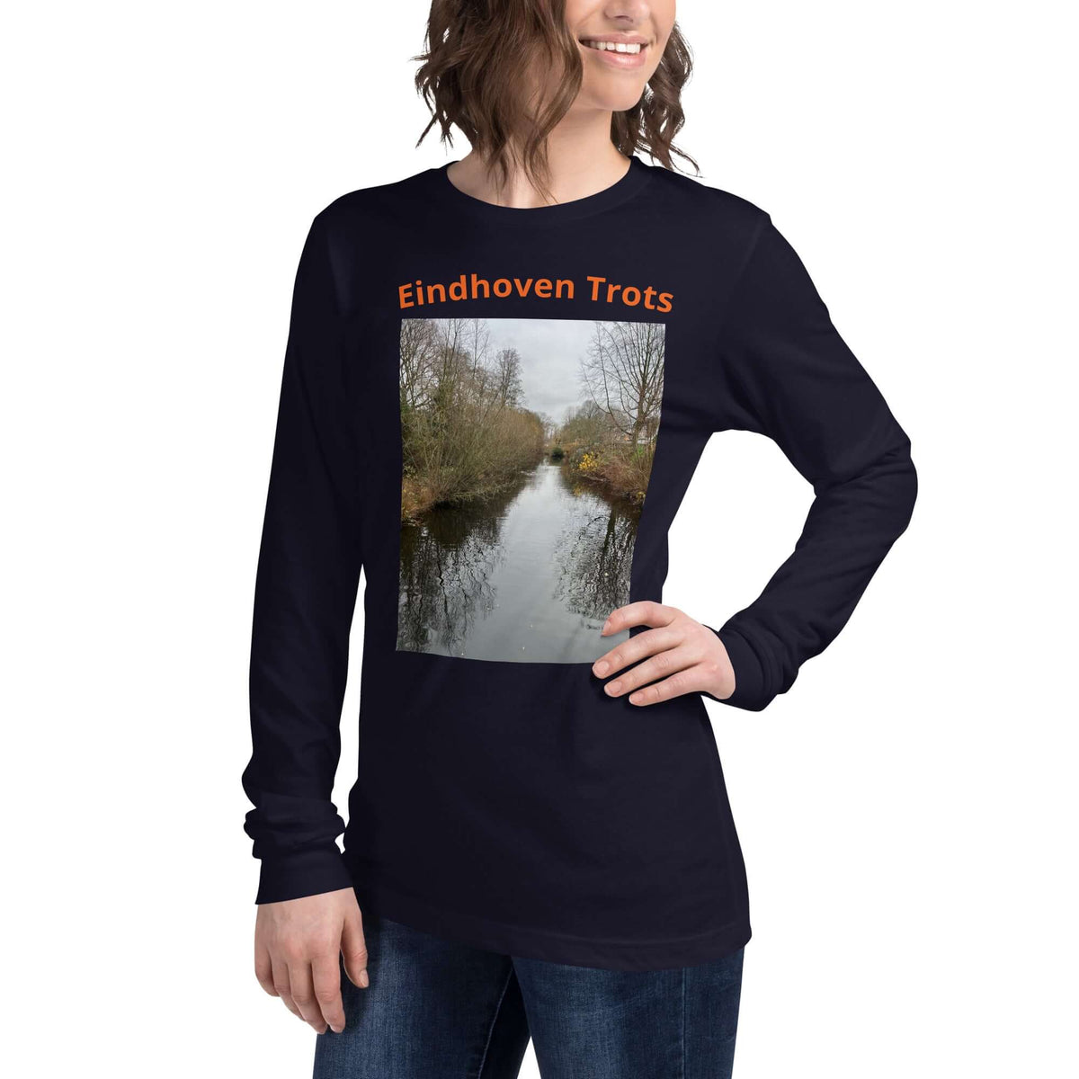 Eindhoven Trots long sleeve t-shirt featuring a scenic photo of a canal in Eindhoven with a model wearing it.