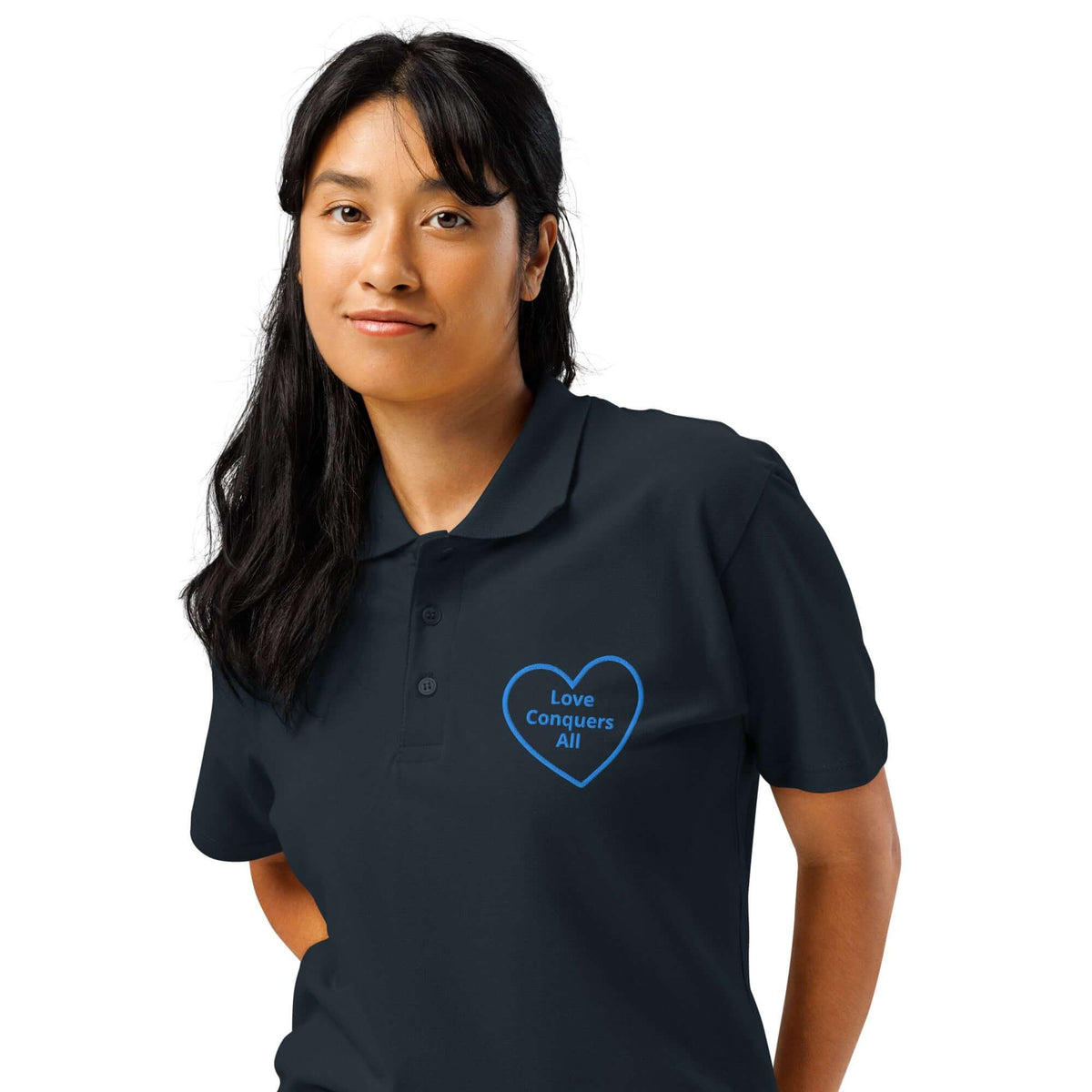 Love Conquers All Polo Shirt displayed on a model wearing a navy polo with a heart design.