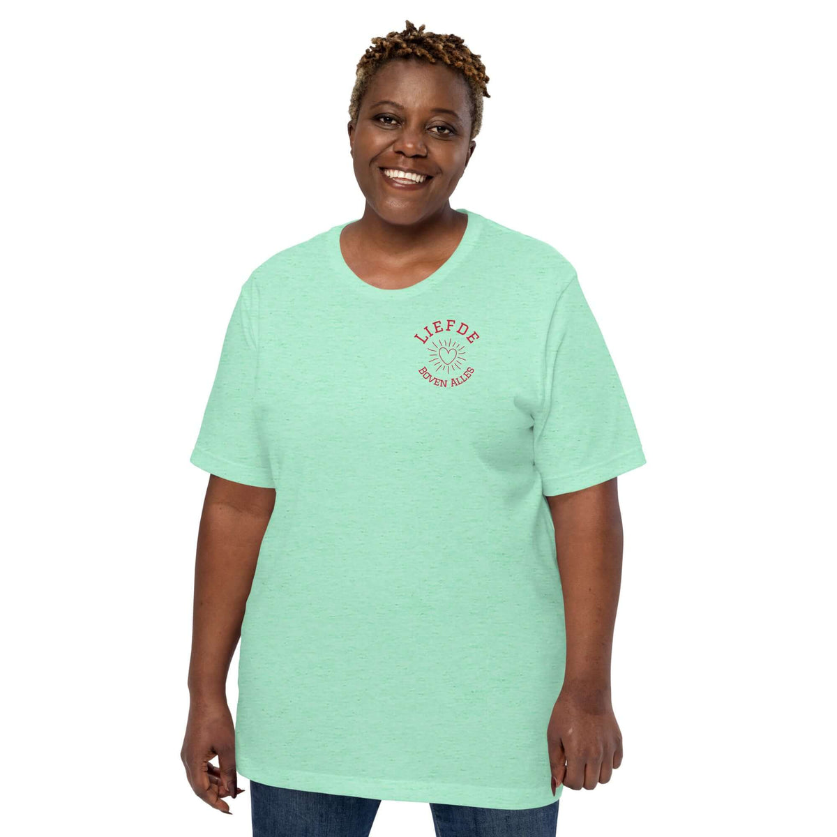 Woman wearing a mint green Liefde Boven Alles T-shirt showcasing comfort and style in casual wear.