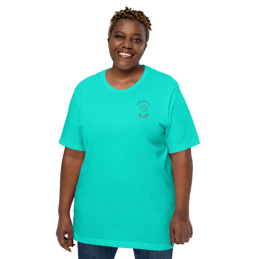 Love Above All Else T-shirt in turquoise, modeled by a smiling woman, showcasing comfort and style.
