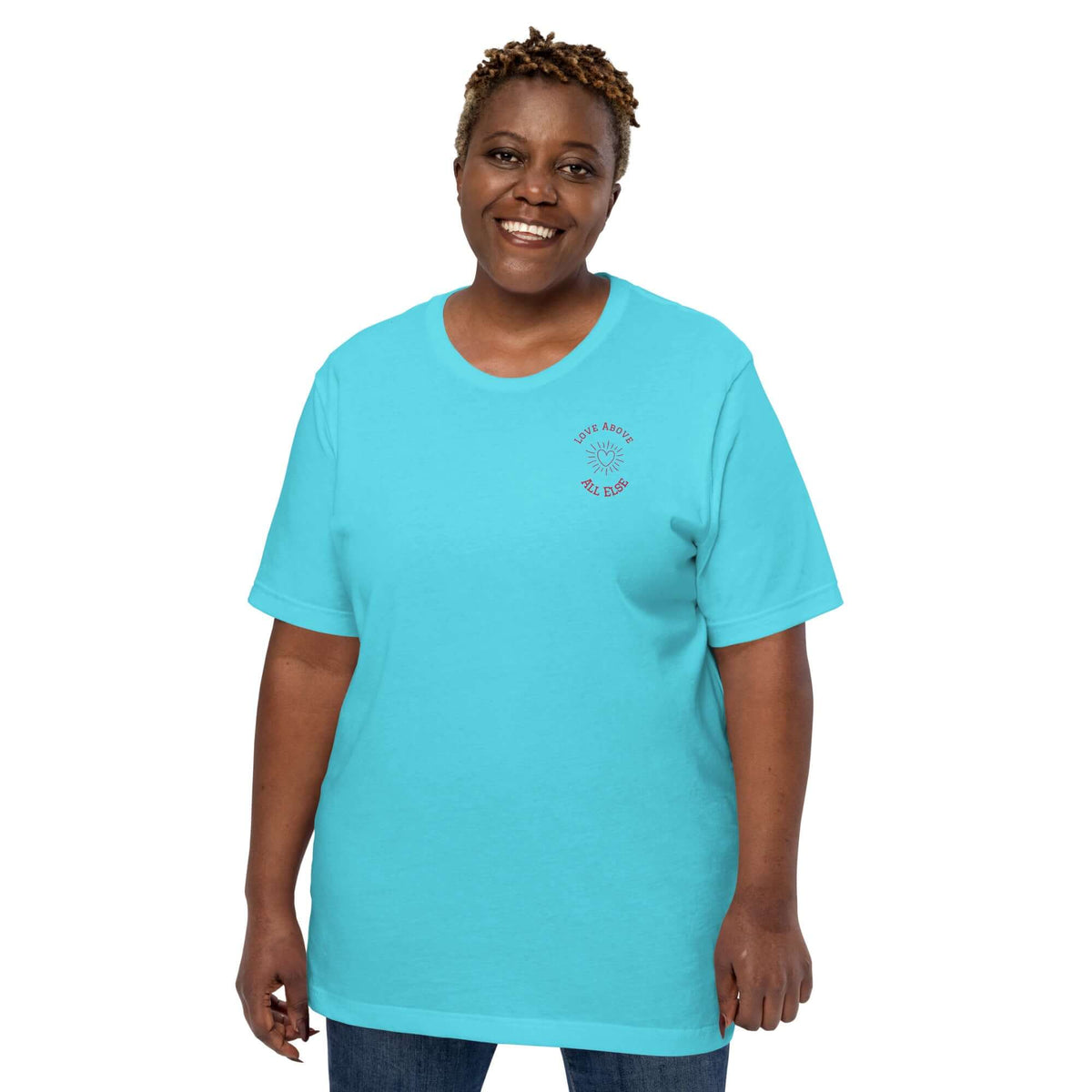 Woman wearing a turquoise Love Above All Else T-shirt, showcasing comfort and style.