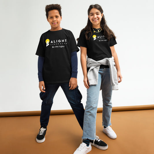 Alight Youth T-shirt worn by kids, showcasing a playful, stylish design that promotes joy and positivity.